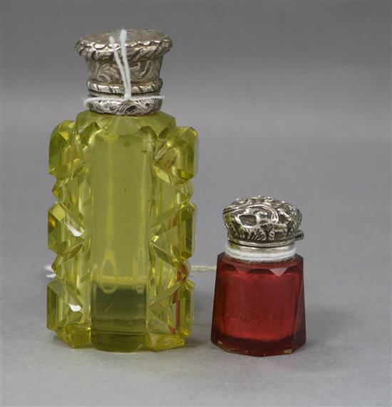 Two late Victorian / Edwardian silver mounted glass scent bottles